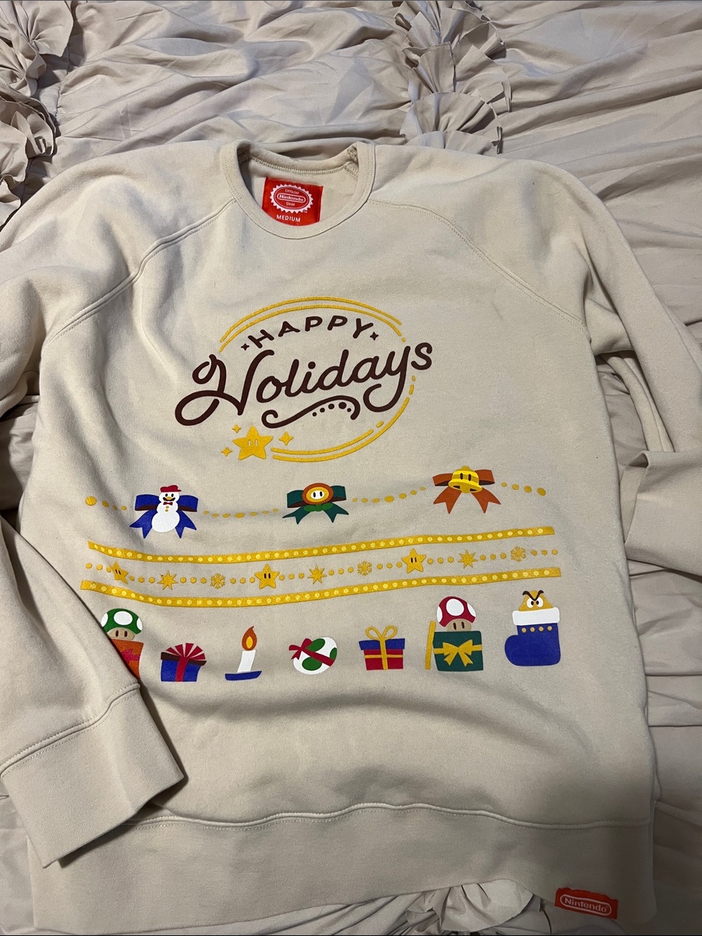 Nintendo Beige 'Happy Holidays' Graphic Sweatshirt with Colorful Game Icons